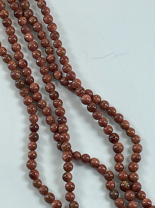 Goldstone 4mm, 16" Strand