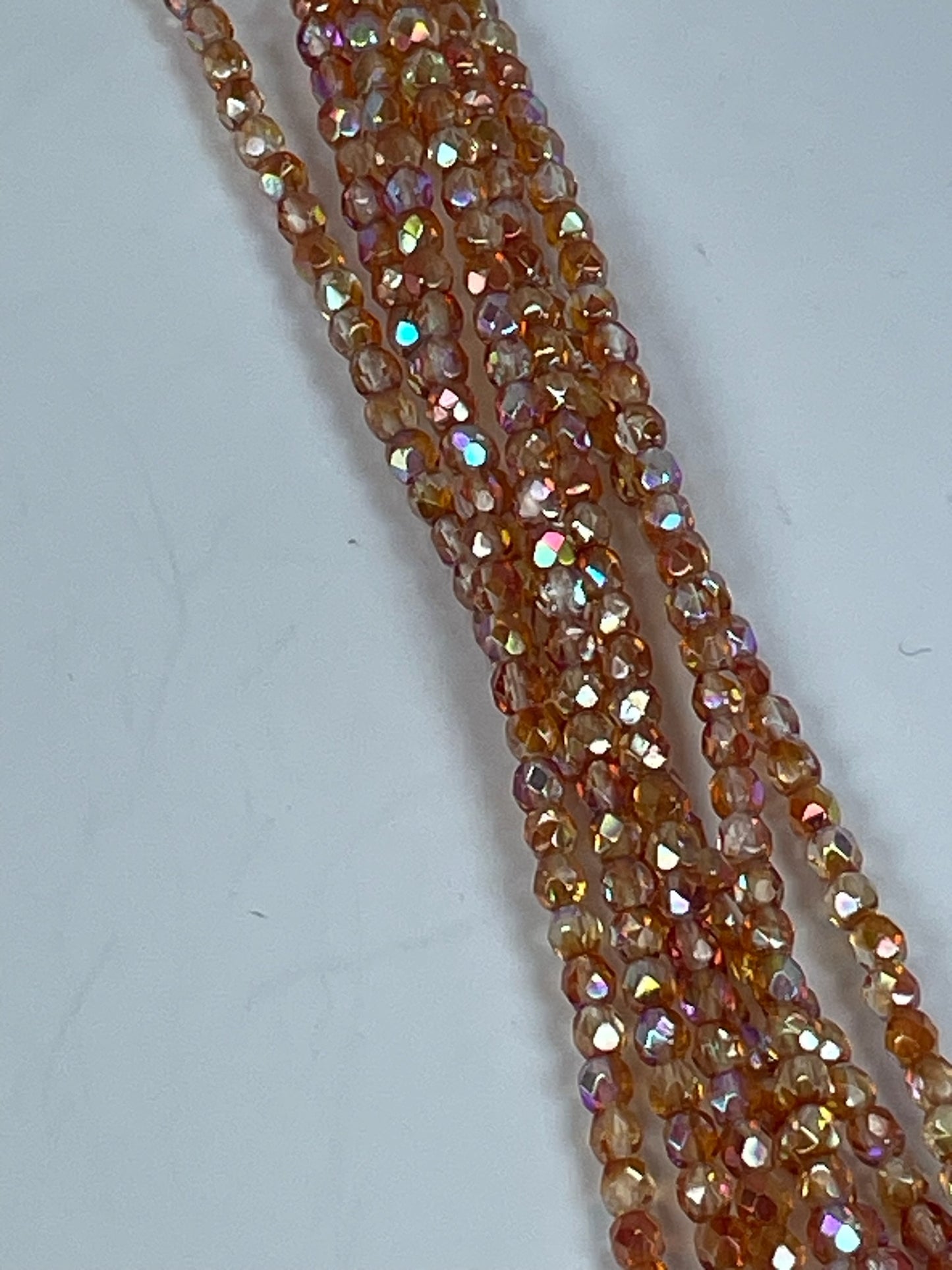 Czech FP Crystal Orange Rainbow, 4mm, 6" Strand